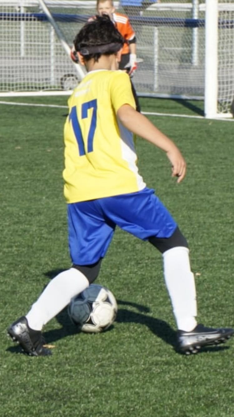 Nico as a child in the ARSQ Québec region shirt, number 17