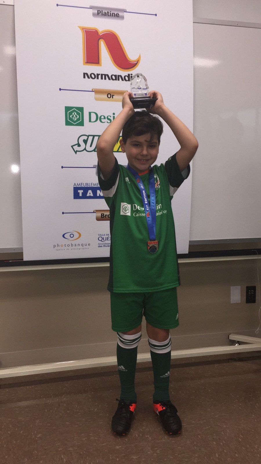 Nico lifting a trophy at the Tournoi Desjardins