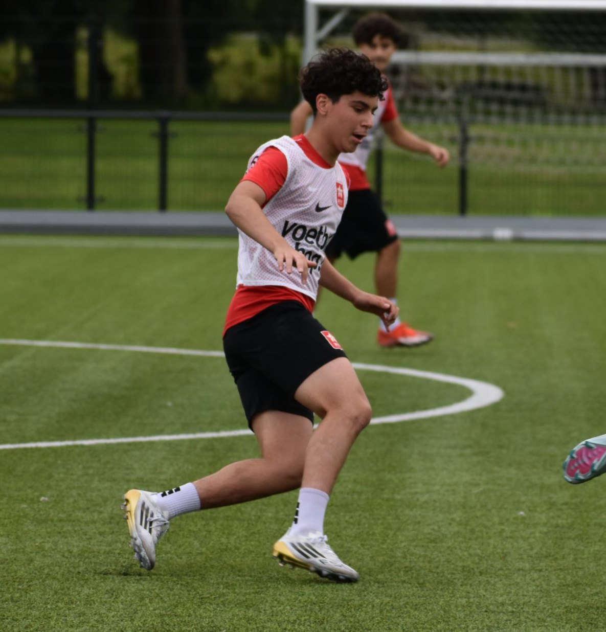 Nico dribbling past a teammate