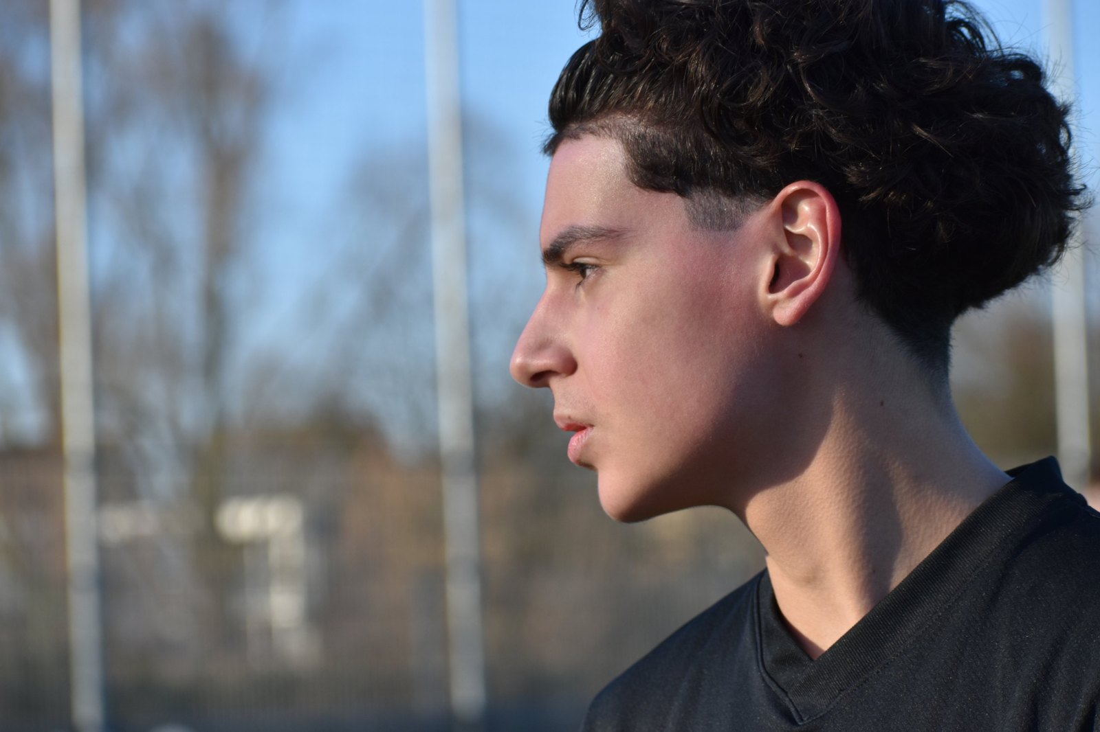 Nico in profile against a blue sky